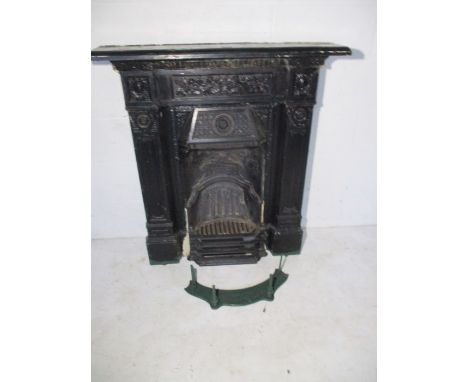 A Victorian cast iron fireplace, has the word "Scotia" on the fire back. Height 103cm, Width 92cm, depth (of mantle shelf) 17