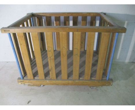 A slatted wooden industrial bobbin trolley