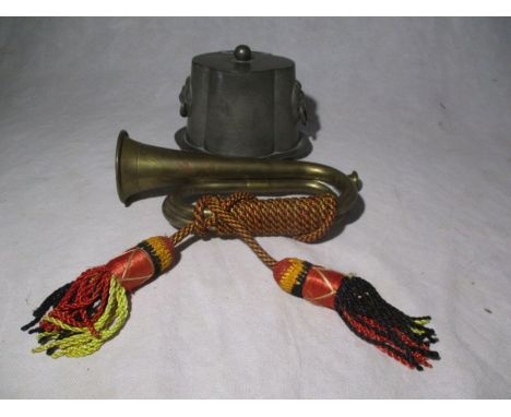 A brass bugle along with a pewter biscuit barrel