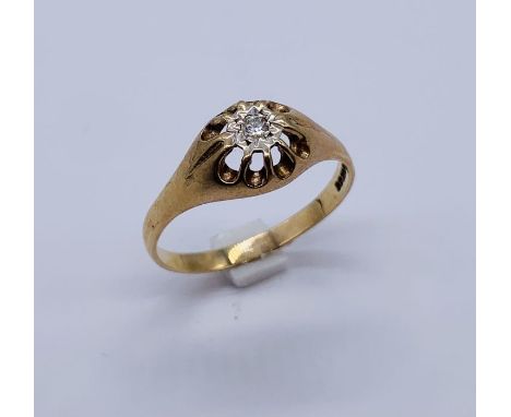 A large sized 9ct gold ring set with a solitaire diamond, weight 3.1g