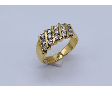 An 18ct gold dress ring set with 5 rows of diamonds