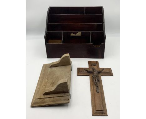 A vintage wooden desk organiser along with a small pine shelf and a crucifix 