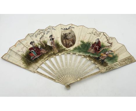 A 19th Century ivory fan with hand painted scenes, each stick ornately carved and pierced