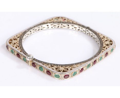 Emerald, Diamond and ruby bangle on silver, made in square form with alternating emeralds and rubies with a ring of diamnods 