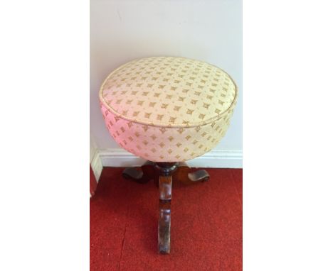 Victorian rise and fall stool, mahogany base with carved legs, upholstered seat with patterned fabric.