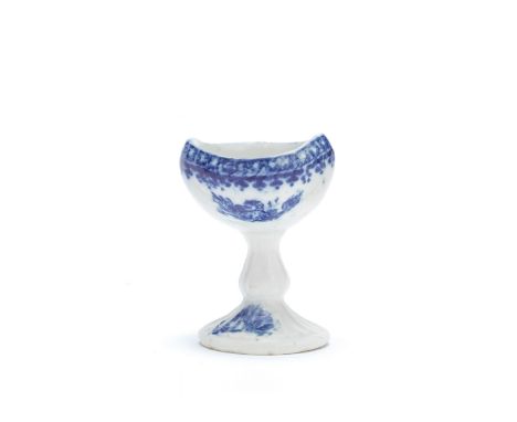 A rare Caughley eyebath, circa 1785-90Of boat shape on a tall baluster stem moulded with scrolls, the oval foot finely reeded