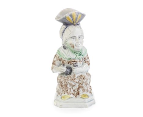 A good pearlware 'Martha Gunn' Toby jug, circa 1790-1800Modelled seated, holding a flask in her right hand and a cup in her l