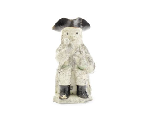 A creamware 'Step' Toby Jug, circa 1780Of traditional form, modelled smoking a pipe held in his raised right hand, an empty j