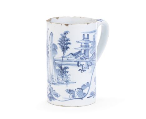 A English delftware mug or tankard, dated 1767Probably London, of large cylindrical shape with a strap handle, painted in blu