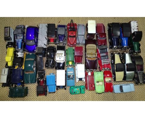 A Franklin Mint 1933 Duesenberg J Victoria, (a/f, no box) and a large quantity of diecast and plastic cars, including six nov