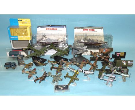 Corgi, twenty-two various WWII aircraft models on stands and two trucks, (all unboxed) and two Atlas battleships, (boxed). 