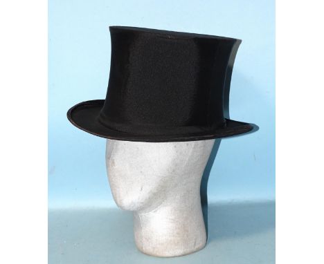 A vintage collapsible silk opera hat. 