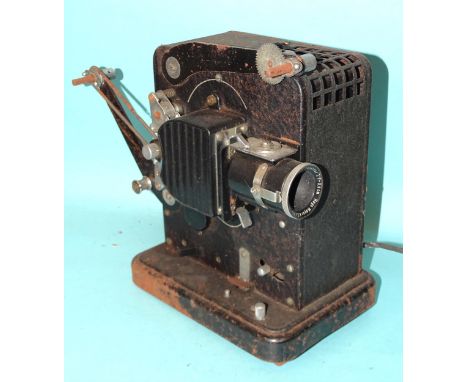 A Eumig ciné film projector with Hugo Meyer Gorlitz Kinon Superior I f:3.5cm lens and seventeen boxed films, including Walt D