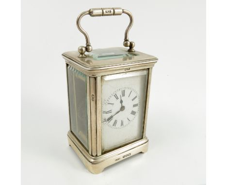 A silver cased miniature carriage clock, with white enamel rectangular dial and Roman numerals, glass sides, Birmingham 1892,