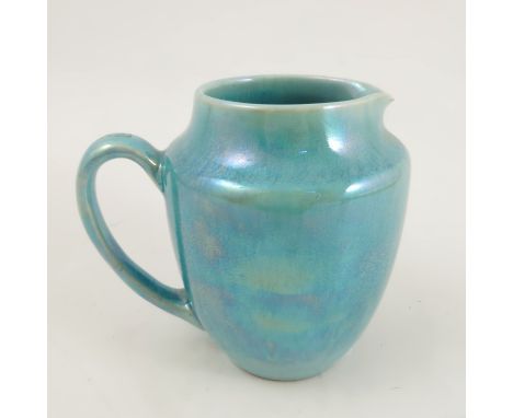 A Ruskin pottery jug, decorated with a light blue lustre glaze, height 4.5ins