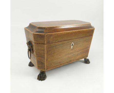 A 19th century rosewood tea caddy, with satinwood stringing, the interior fitted with two pull out caddies flanking a central
