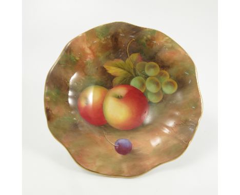 A Royal Worcester pedestal dish, with shaped edge, decorated with fruit to a mossy background by Shuck, diameter 5.5ins  Cond