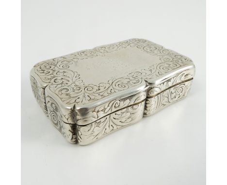 A Victorian silver snuff box, of shaped rectangular form, the lid engraved with scroll framing an inscription (rubbed), with 