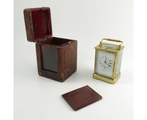 A brass cased repeating carriage clock, the white enamel dial marked Henry Marc Paris, with striking movement, height includi