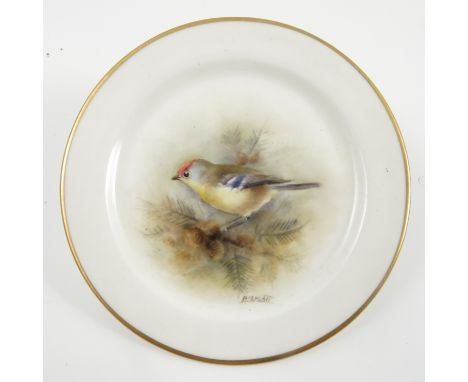 A Royal Worcester dish, hand painted with a Goldcrest by P M Platt, dated 1954, diameter 3.5ins