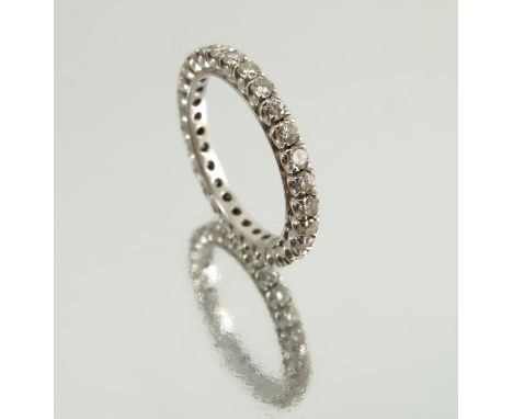 A diamond full eternity ring, the unmarked white mount set with twenty nine brilliant cuts totalling approximately 0.87 carat