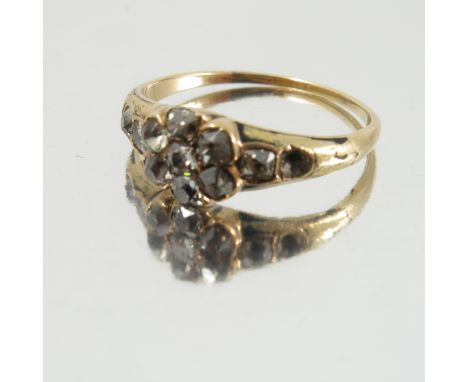 A Victorian diamond cluster ring, one replacement paste, traces of black enamel, diamond set shoulders, finger size S, 3g gro