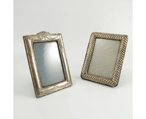 A silver mounted frame, of rectangular form with embossed swags and ribbons, velvet back and easel support, Birmingham 1907, 