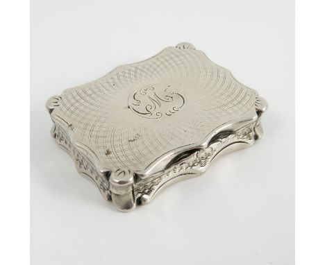 A Victorian silver vinaigrette, of shaped rectangular form with engine turned decoration to the case and engraved pierced gri