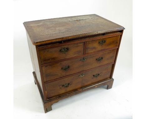 An 18th century walnut chest, of two short drawers over two long graduated drawers with quarter veneered feather and cross ba