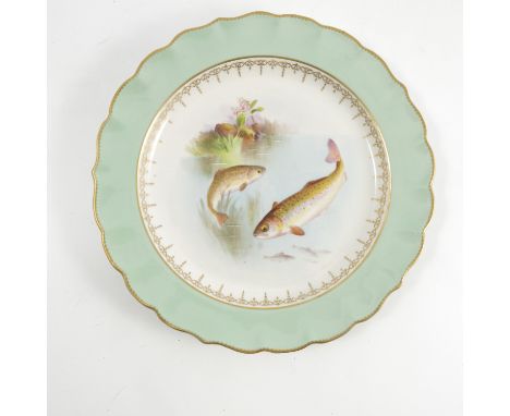 A Royal Worcester plate, decorated trout, to a green border with shaped edge, dated 1902, diameter 9.25ins