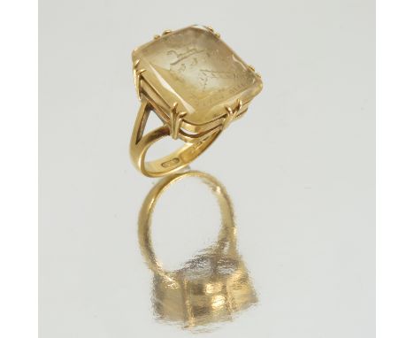 A citrine armorial intaglio ring, to a 22 carat gold mount, finger size K, 7.5g gross, together with an oil on board of the A