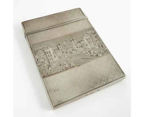 A cased Victorian silver double sided castle top card case, each side depicting a view of Windsor Castle, with to engine turn