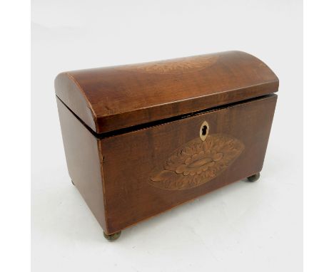 A 19th century mahogany dome top tea caddy, with inlay to the top and front, the interior with two compartments, raised on fo