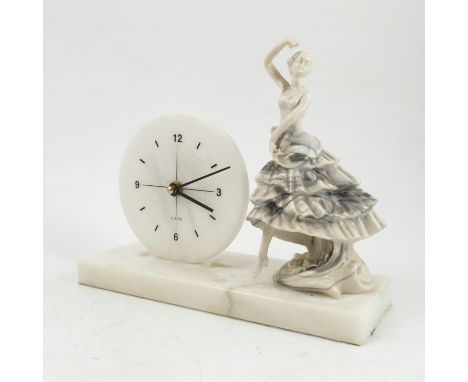 A white marble mantel clock, the rectangular base with circular dial having a quartz movement, with Spanish dancer to the sid