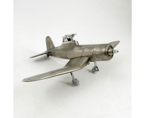 A Japanese white metal table lighter, modelled as a Corsair airplane, numbered F4U-1, length 8ins