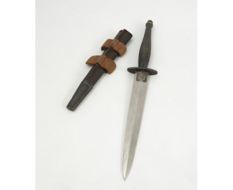 A Fairbairn Sykes FS fighting knife, World War II pattern, by Wilkinson Sword, with leather and metal scabbard, by repute bel