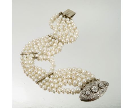 A four row freshwater cultured pearl bracelet, to a diamond clasp, of nanette shape set with five graduated old brilliant cut