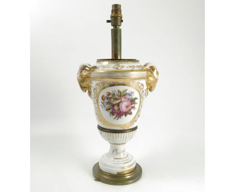 A Continental porcelain lamp base, with ram mask handles, decorated with a reserve of flowers with gilt decoration to a white