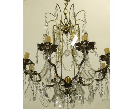A gilt metal and glass chandelier, having eight branches with glass lustre and droppers