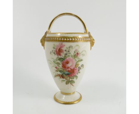 A Royal Worcester basket, decorated with floral spray to front and back, fixed handle over with gilt lion masks and jewelling