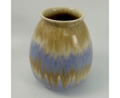 A Ruskin Pottery vase, of bulbous form, decorated in bands of beige and pale blue with a lustre glaze, dated 1931, signed W H