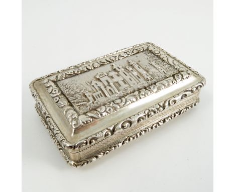 A Georgian silver castle top snuff box, of rectangular form, the stopped lid embossed with a view of Abbotsford House, with f
