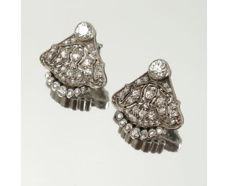 A pair of diamond earstuds, of fan design, the principal brilliant cut stone to each earring of approximately 0.25 carats, th