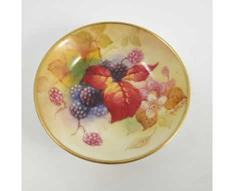 A Royal Worcester pin dish, hand painted with Autumnal fruits and berries by Kitty Blake, dated 1938, diameter 2.75ins 