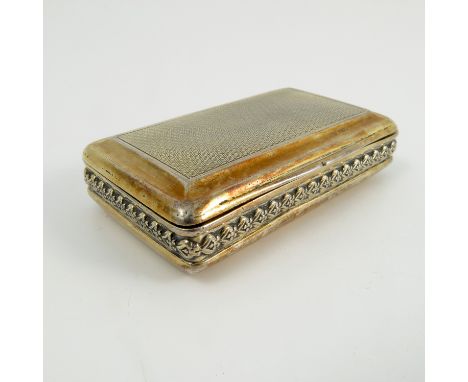 A Georgian silver gilt snuff box, of rectangular form with engine turning to the top and base with moulded sides, London 1811