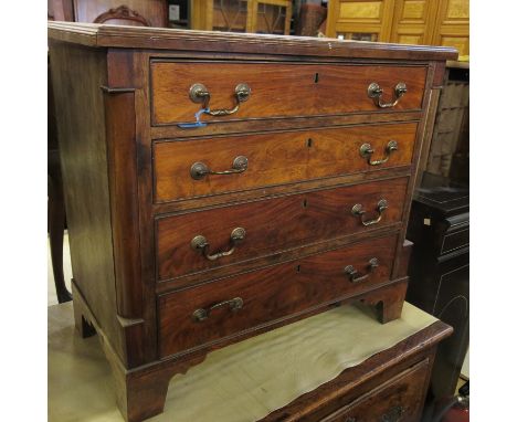 A mahogany chest, of four long drawers, with column ends, raised on bracket feet, width 29.5ins