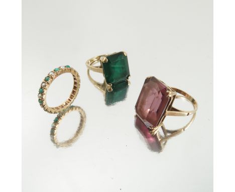 A green paste large single stone 9 carat gold ring, another purple paste set ring stamped '9ct', and a seed pearl and turquoi