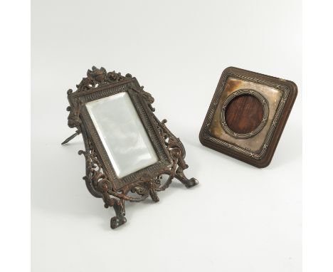 A hallmarked silver mounted frame, of rectangular form with circular aperture, wooden back and easel support, together with a