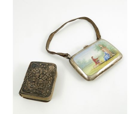 A silver ladies purse, of rectangular form, decorated with an enamelled panel of two figures seated in a garden landscape wit