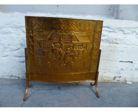 An embossed copper fire screen 